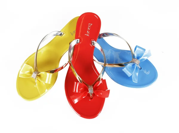 Färgade flip-flops med rosetter — Stockfoto