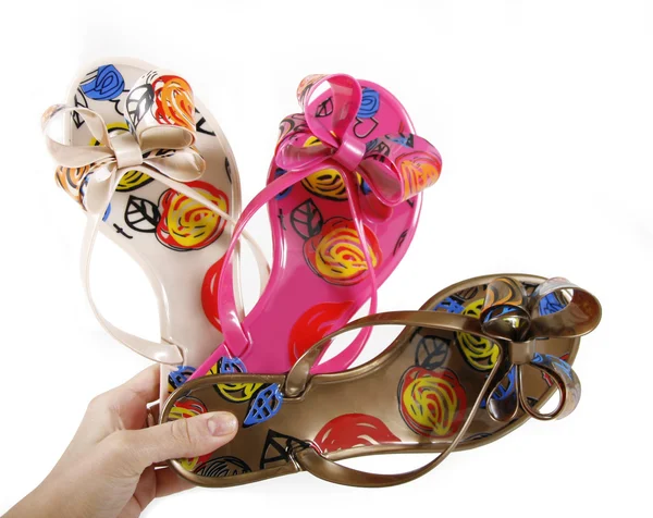 Pattern jelly flip-flops in hand — Stock Photo, Image