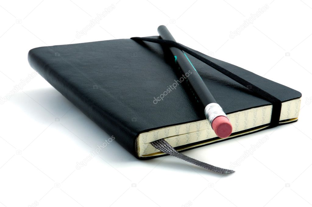 Pencil on top of notebook