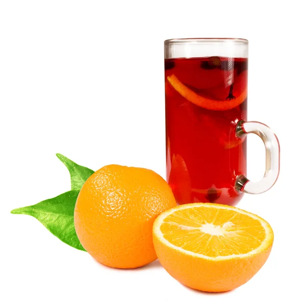 Glass with a cocktail and oranges — Stock Photo, Image
