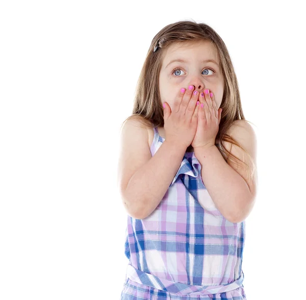 Young girl with hands over mouth on white — Stock Photo, Image