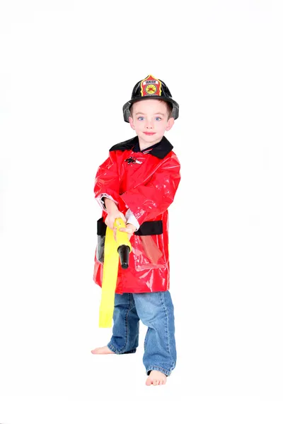 Voorschoolse leeftijd jongen in firman kostuum — Stockfoto