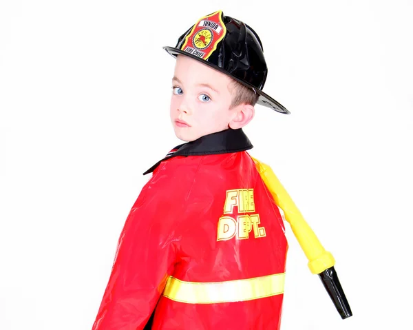 Jovem em traje de bombeiro — Fotografia de Stock