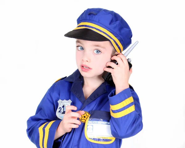 Jonge jongen in politie kostuum — Stockfoto