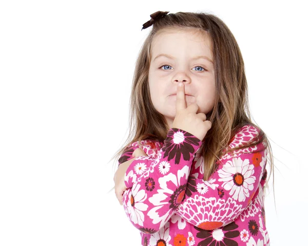 Pretty child with finger over lips — Stock Photo, Image