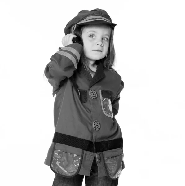 Klein meisje in politie kostuum — Stockfoto
