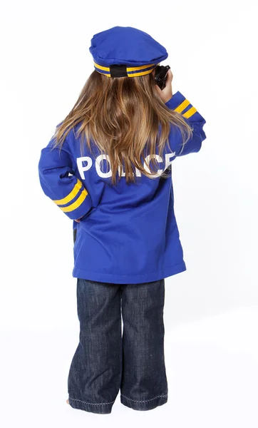 Jong meisje in politie kostuum — Stockfoto