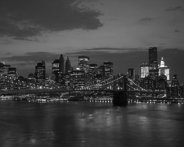 Brooklyn bridge and NYC skyline at sunset in black and white
