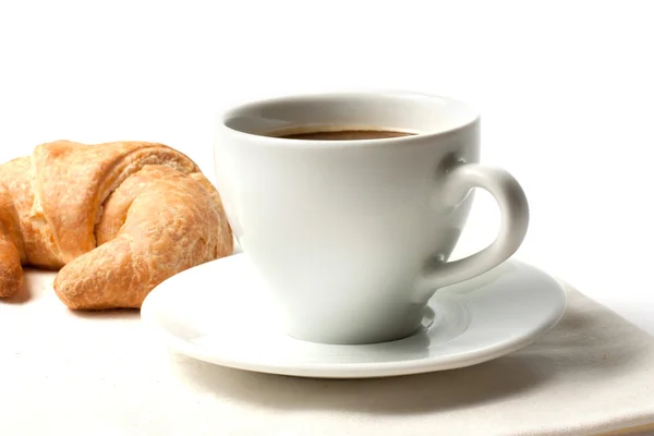 Cup of coffee and croissant — Stock Photo, Image