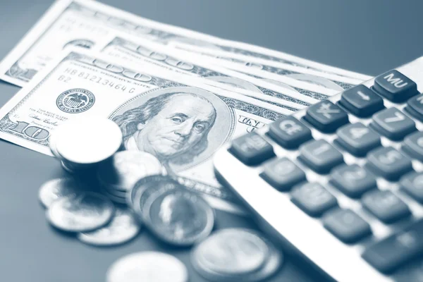 Dólar, moeda e uma calculadora — Fotografia de Stock