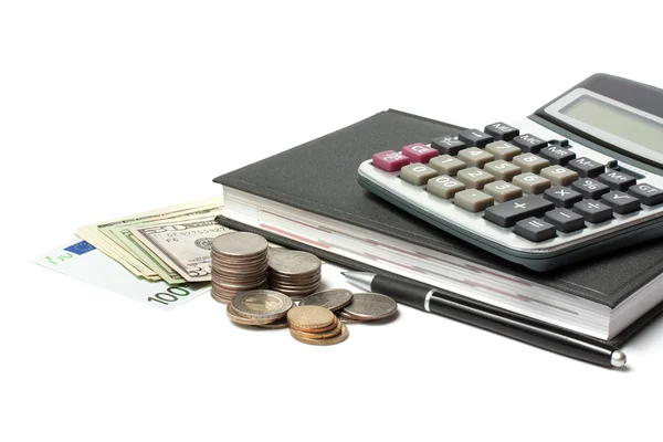 Деньги, калькулятор, дневник и ручка — стоковое фото