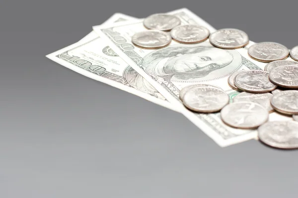 Coins and dollar bills — Stock Photo, Image