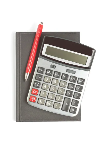 Калькулятор, красный карандаш и дневник — стоковое фото