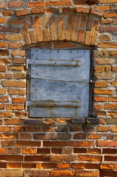 stock image Old brick wall with door