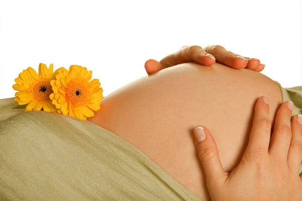 Zwangere buik met bloemen — Stockfoto