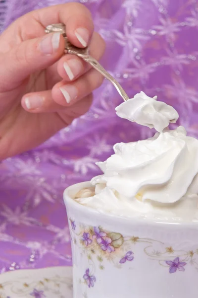 Spoon in cream — Stock Photo, Image