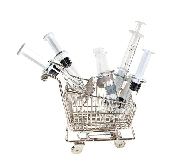 Shopping cart with syringes — Stock Photo, Image