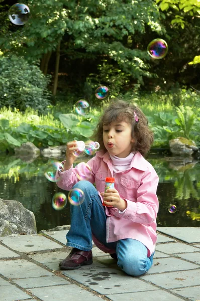 Soap bubbles at the pond — Stock Photo, Image