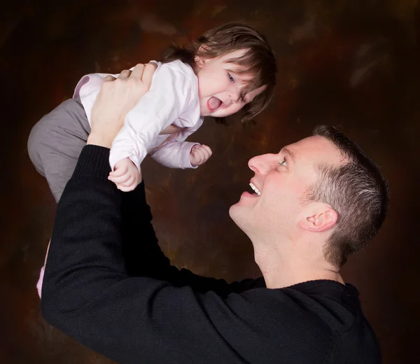 High in dad's hands — Stock Photo, Image