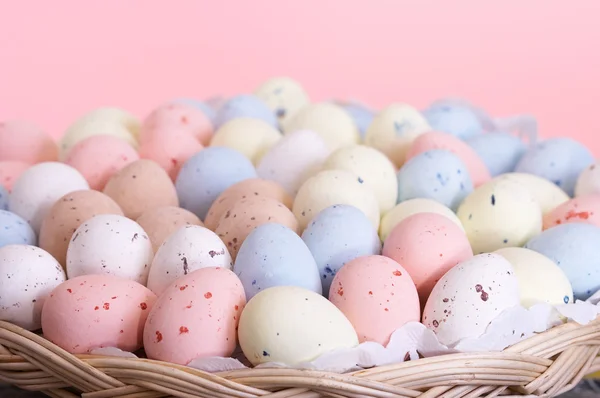 Pastel eggs in a basket — Stock Photo, Image