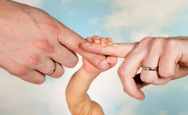 Baby hands and parents — Stock Photo, Image