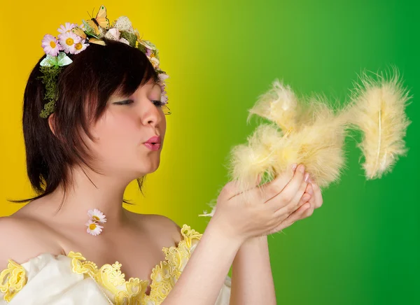 Fluffy easter feathers in springtime — Stock Photo, Image