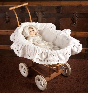 Antique doll in cradle clipart