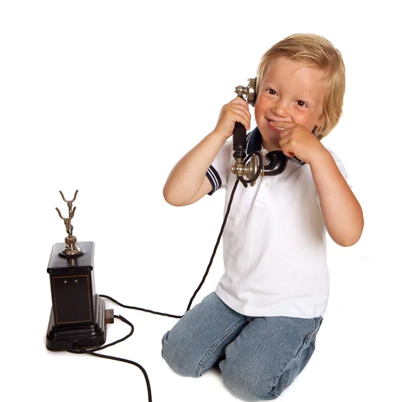 Telefone antigo e menino — Fotografia de Stock