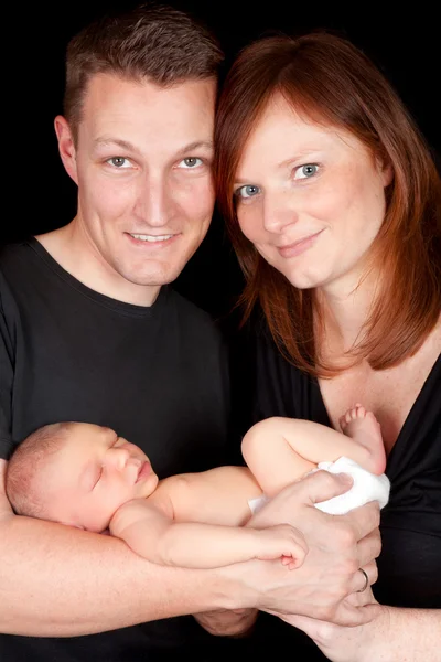 Couple with newborn child — Stock Photo, Image