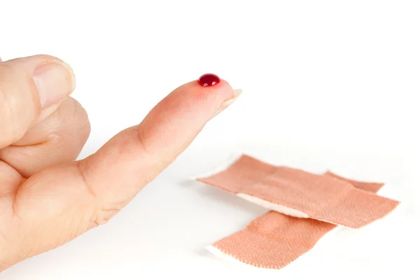Kan parmak ve yara bandı — Stok fotoğraf