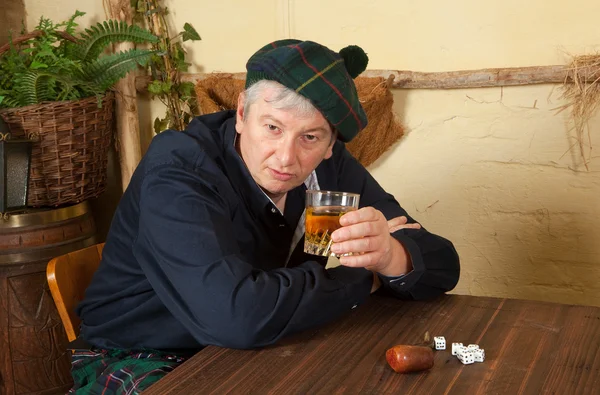Funny Scotsman drinking whisky — Stock Photo, Image