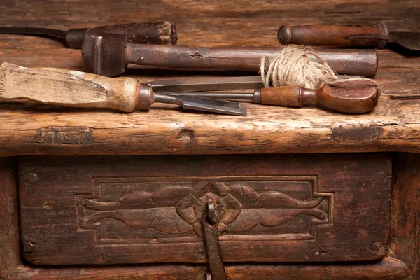 Wooden bench and rusty tools — Stock Photo, Image