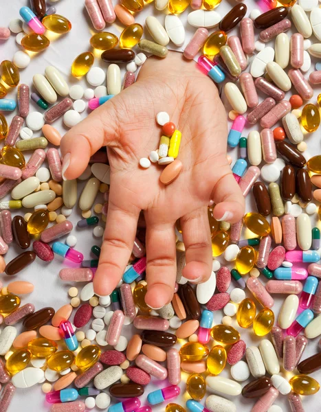 Drowning in pills — Stock Photo, Image