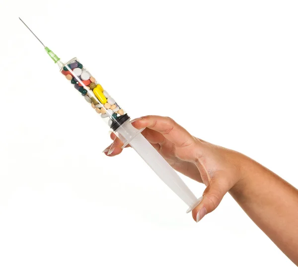 Injectiespuit vol pillen — Stockfoto