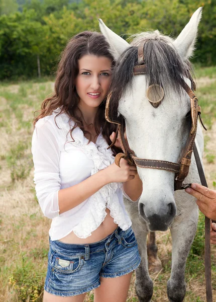 Portrait of a woman with a horse — Stock Photo, Image