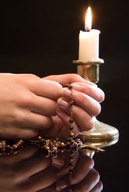 Rosary in prayer clipart