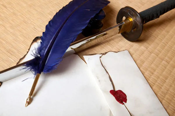 Feather sword and letter — Stock Photo, Image