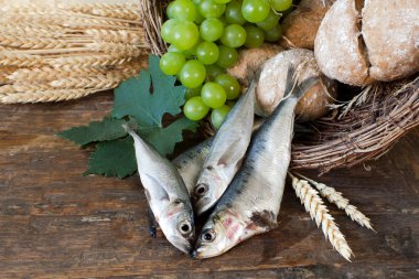 Holy bread with basket of fish clipart