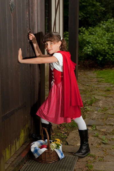 stock image Red riding hood at grandmother's house