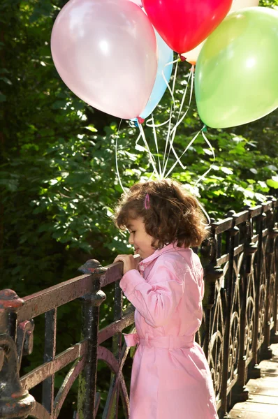 Holding balloons — Stock Photo, Image