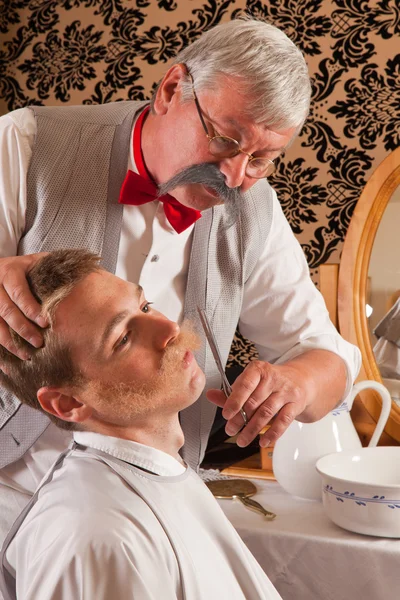 stock image Barber cutting mustache
