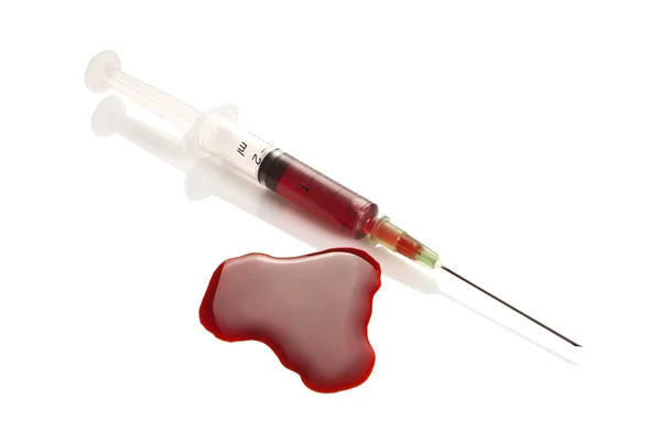 Syringe and blood splat — Stock Photo, Image