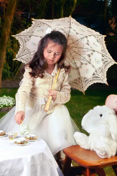 Drinking tea as Alice in Wonderland — Stock Photo, Image