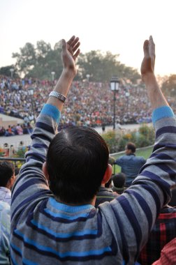 Indian celebrating during the border closing ceremony clipart