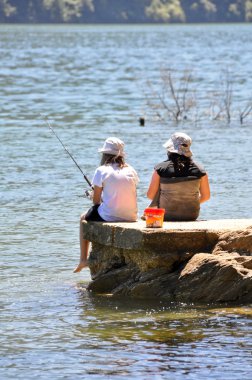 Children fishing, Marlborough Sounds (New Zealand) clipart