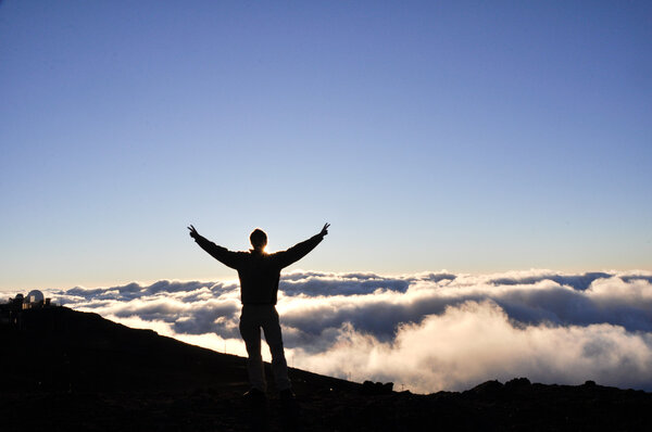 A man on top of Haleakala National Park - Maui, Hawaii