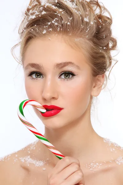 Girl with candy cane — Stockfoto