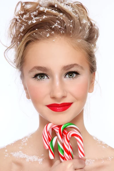 Chica con bastones de caramelo — Foto de Stock