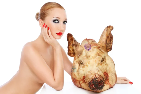 Young beautiful sexy woman with dead pigs head — Stock Photo, Image