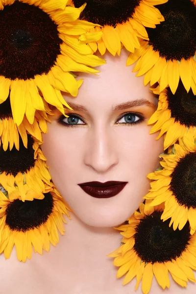 Woman in sunflowers — Stock Photo, Image